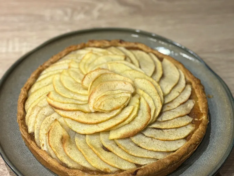 Canned apple pie filling in quart jars with cinnamon and fresh apples