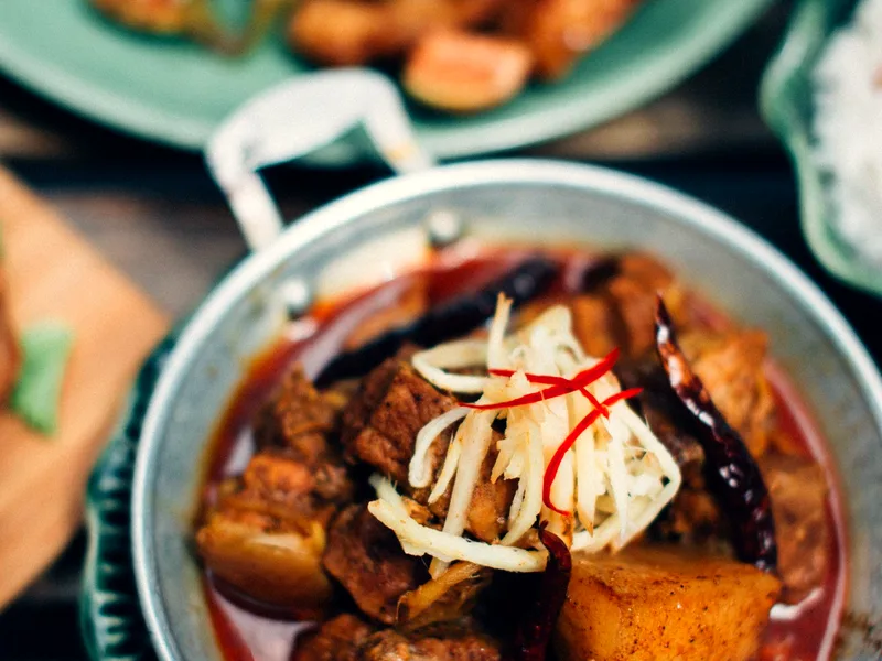 Beef stew with potatoes served in a rustic bowl