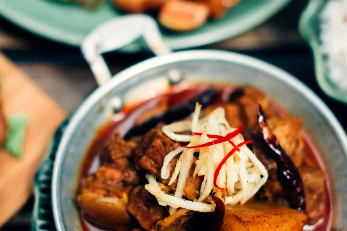 Beef stew with potatoes served in a rustic bowl