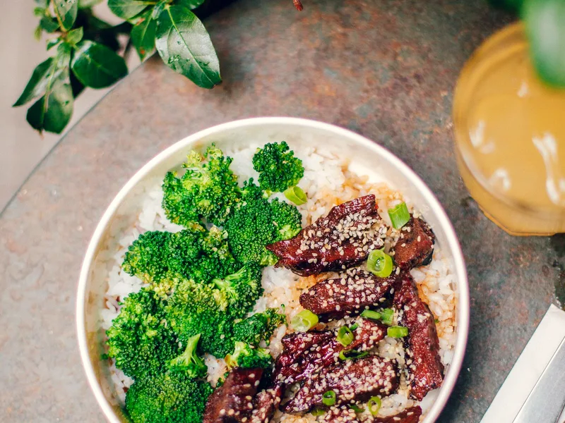 A bowl of rice with broccoli — cheesy broccoli rice casserole, served