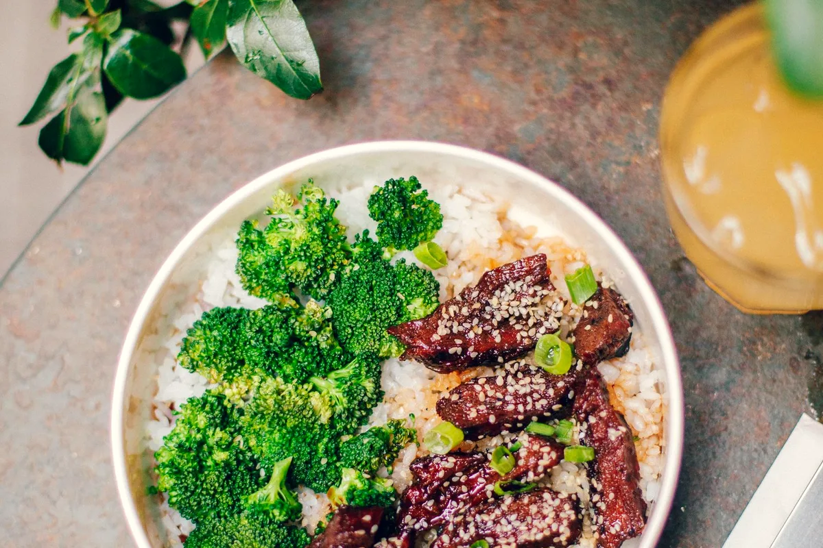 A bowl of rice with broccoli — cheesy broccoli rice casserole, served