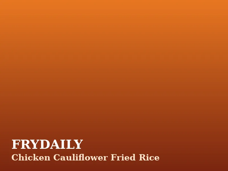 Chicken cauliflower fried rice in a bowl with peas, carrots, egg and green onions