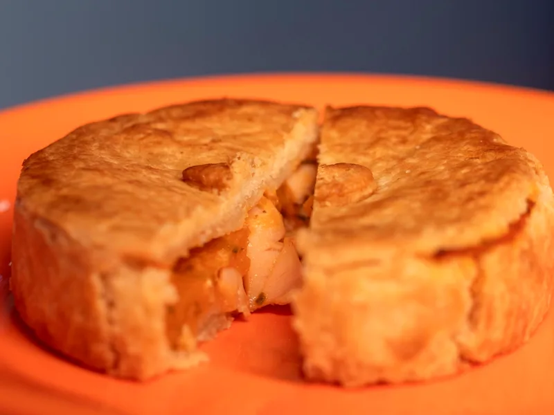 Easy chicken pot pie casserole with creamy chicken and vegetables under a golden biscuit topping