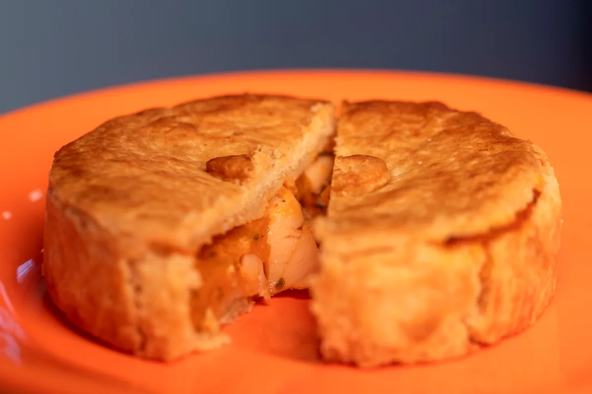 Easy chicken pot pie casserole with creamy chicken and vegetables under a golden biscuit topping