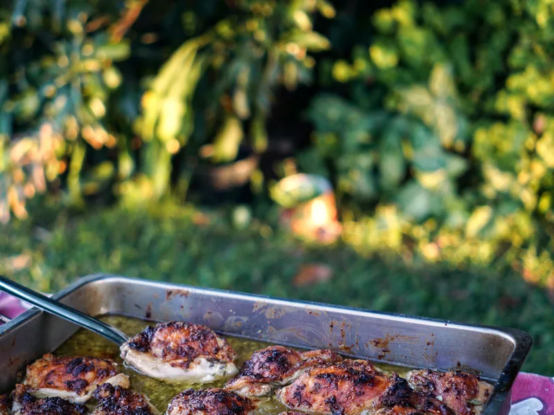 Crispy air fryer chicken thighs with golden paprika skin served with fries and salad
