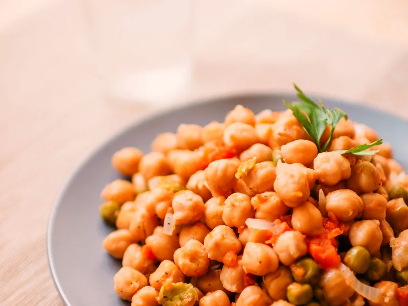 Mediterranean chickpea salad with cucumber, tomatoes, olives and crumbled feta