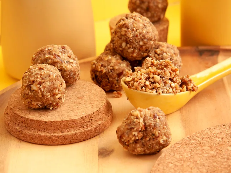 No-bake peanut butter balls coated in chocolate on a serving plate