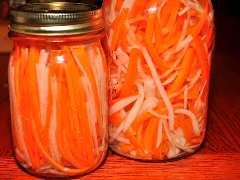 Easy refrigerator pickled carrots in a glass jar with garlic, dill and vinegar brine