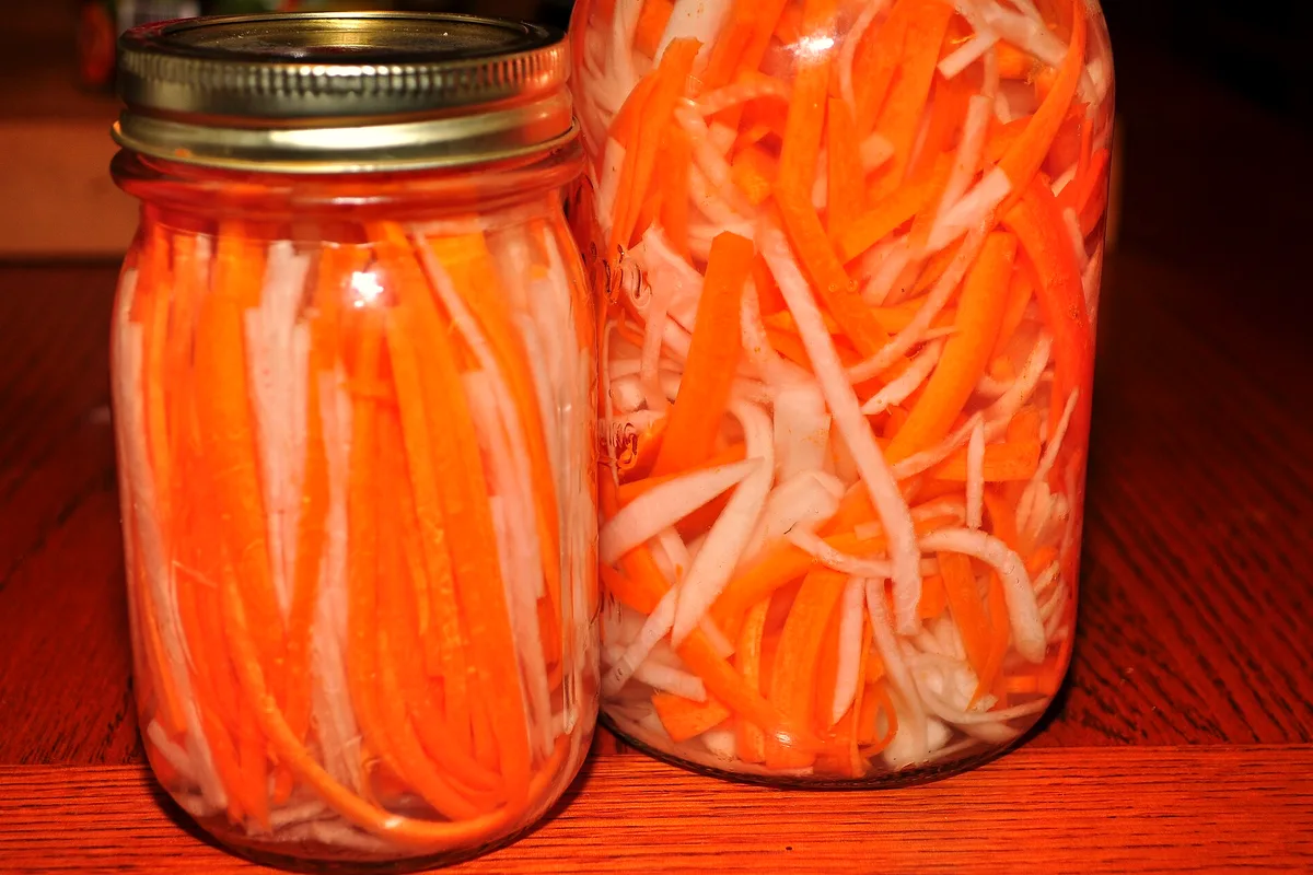 Easy refrigerator pickled carrots in a glass jar with garlic, dill and vinegar brine