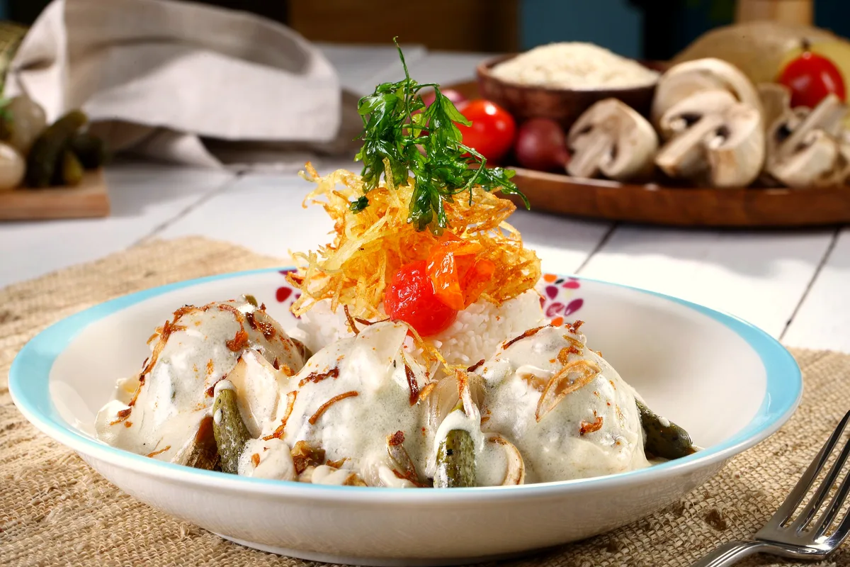 Slow cooker creamy ranch chicken shredded in a tangy cream cheese sauce with fresh herbs