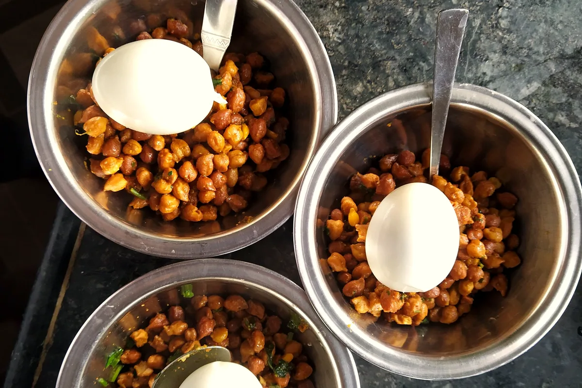 Crispy roasted chickpeas seasoned with paprika served in bowls as a crunchy snack
