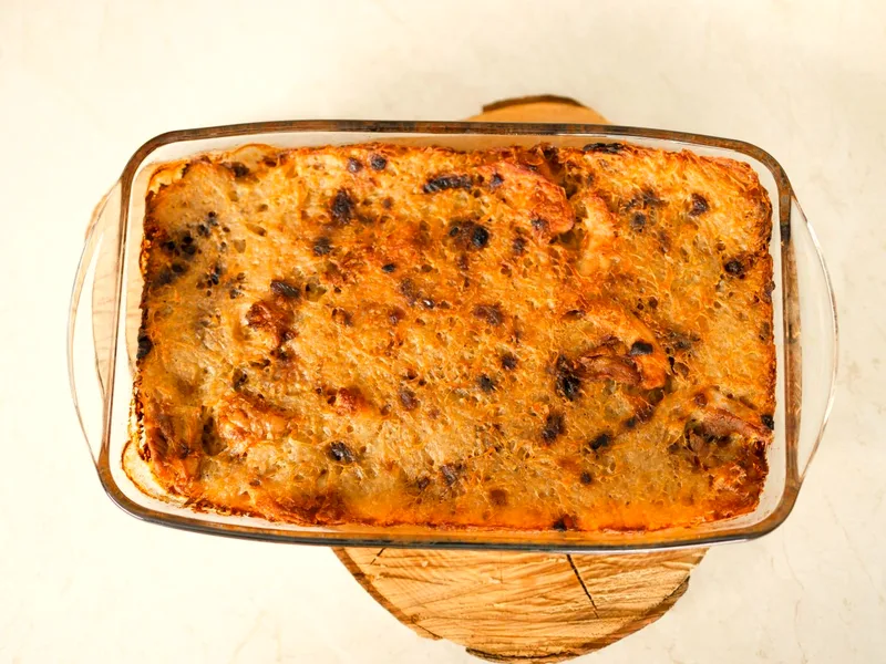 Easy sausage breakfast casserole with eggs, cheddar and golden hash browns in a baking dish