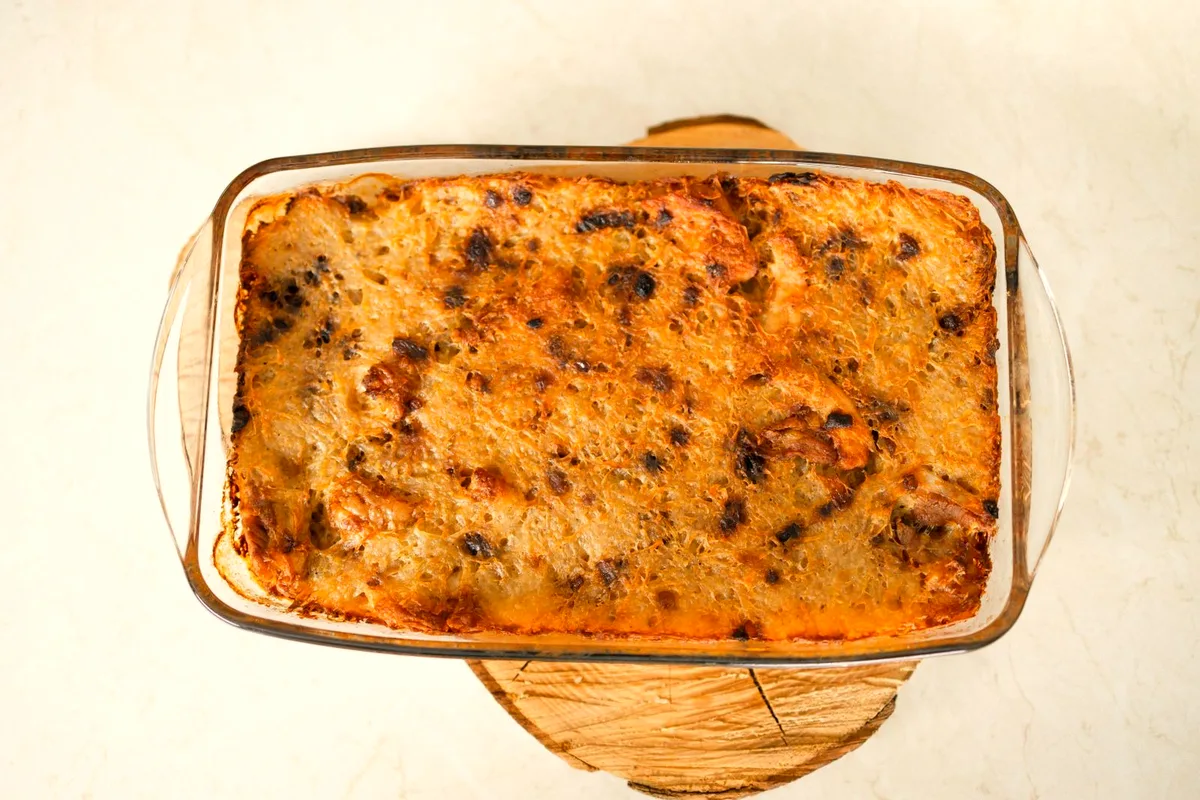 Easy sausage breakfast casserole with eggs, cheddar and golden hash browns in a baking dish