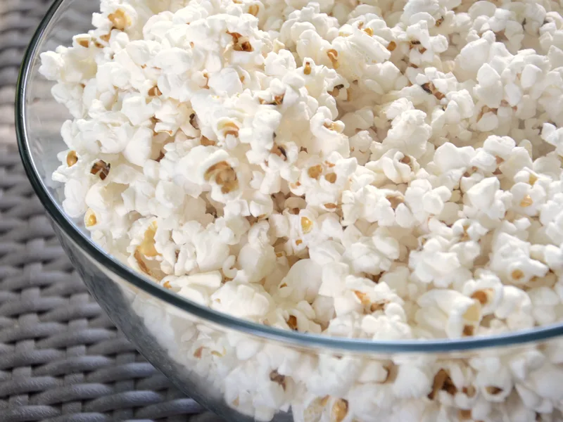 Large bowl of freshly popped white popcorn, crisp and lightly salted