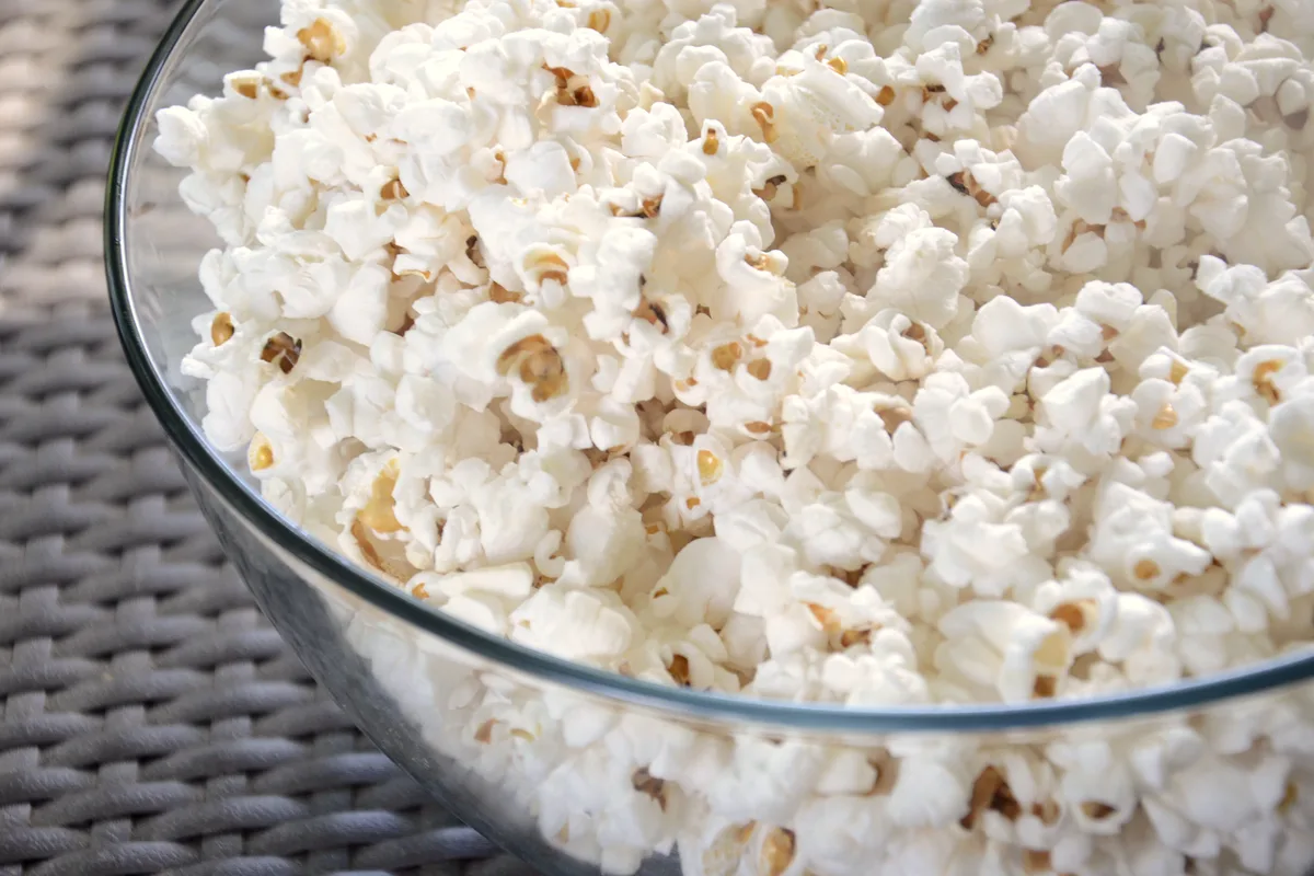 Large bowl of freshly popped white popcorn, crisp and lightly salted
