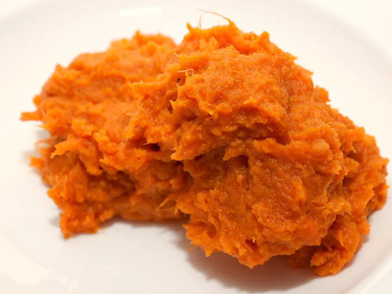 Easy sweet potato casserole with pecan topping in a baking dish, golden and bubbling at the edges