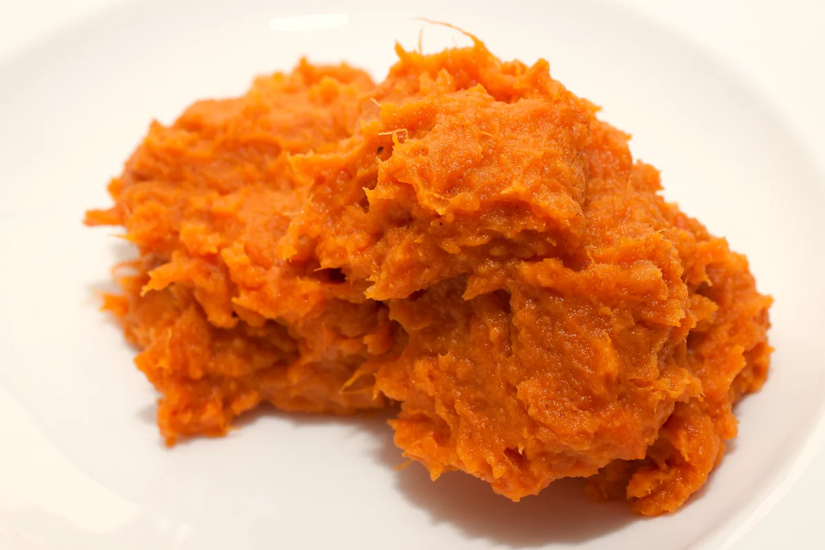 Easy sweet potato casserole with pecan topping in a baking dish, golden and bubbling at the edges