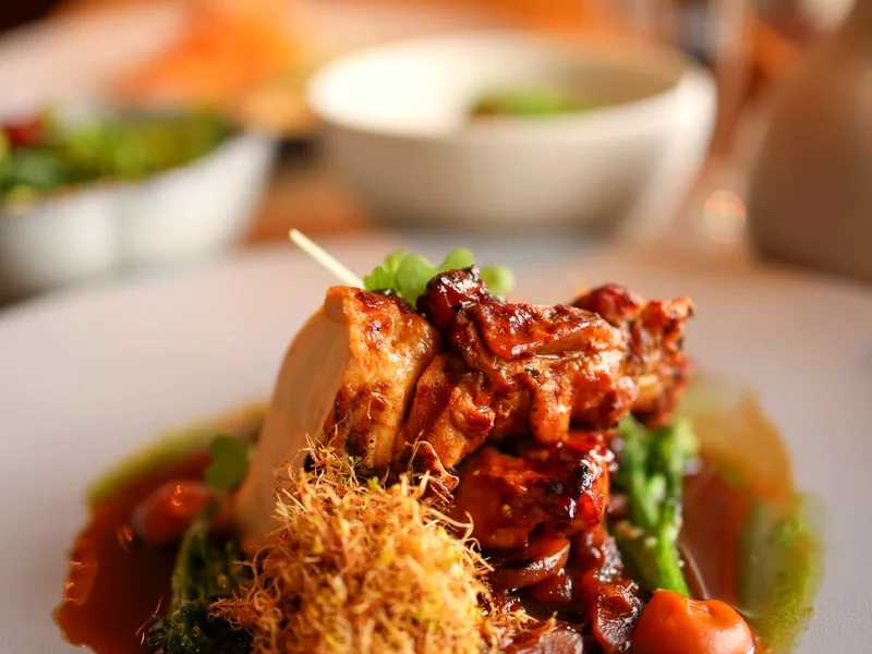 Creamy Tuscan chicken with rich sauce and vegetables served on a plate