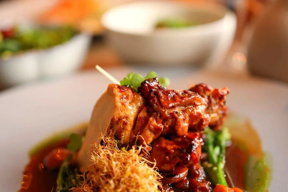Creamy Tuscan chicken with rich sauce and vegetables served on a plate
