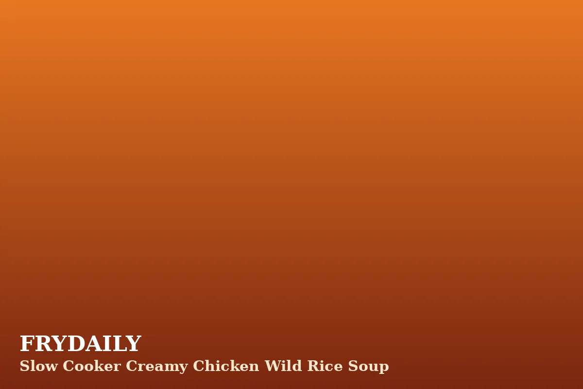 Slow cooker creamy chicken wild rice soup in a bowl with tender chicken, wild rice and carrots in a creamy broth